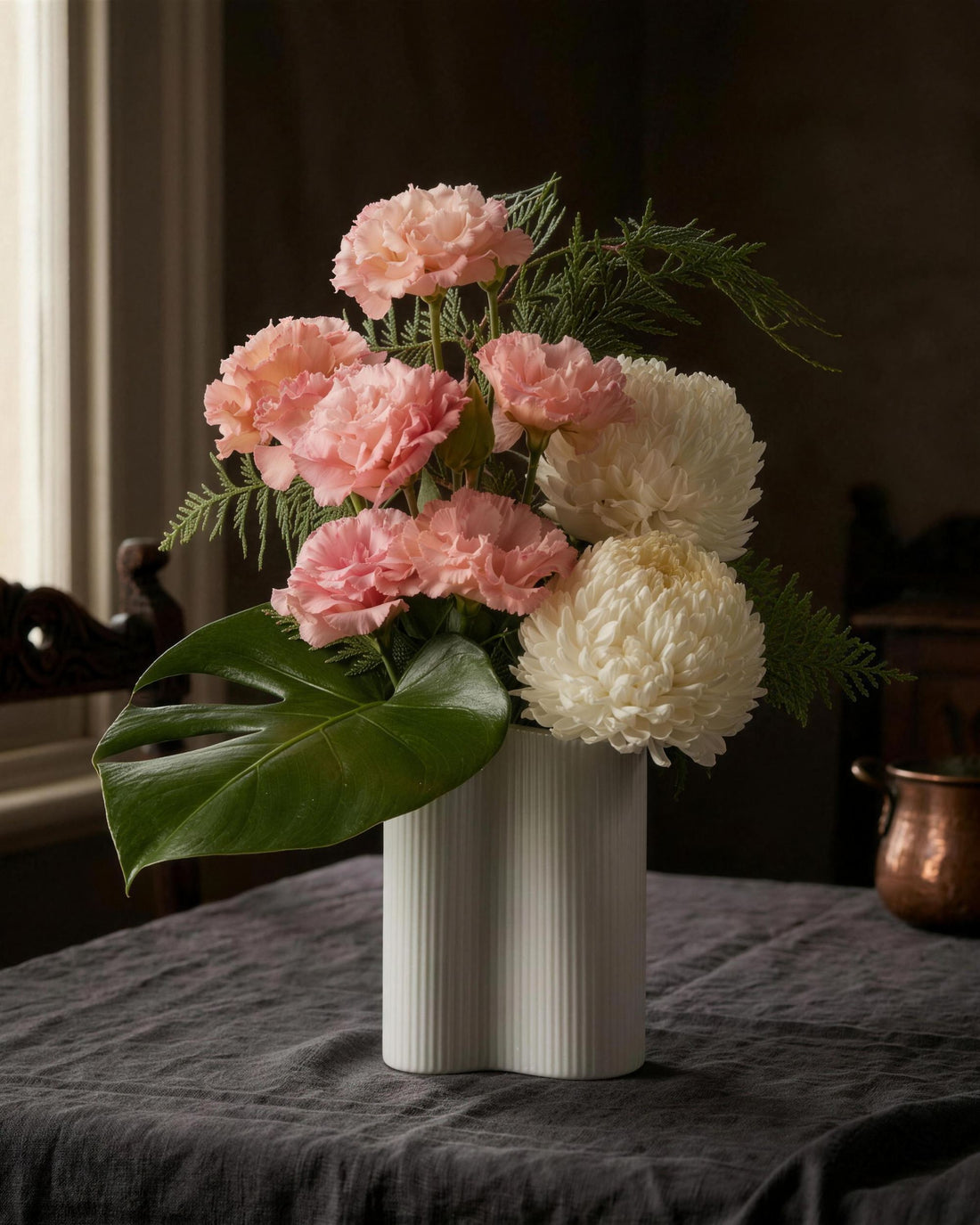 Monaco Arrangement in pink by Fig & Bloom in window light on a linen table
