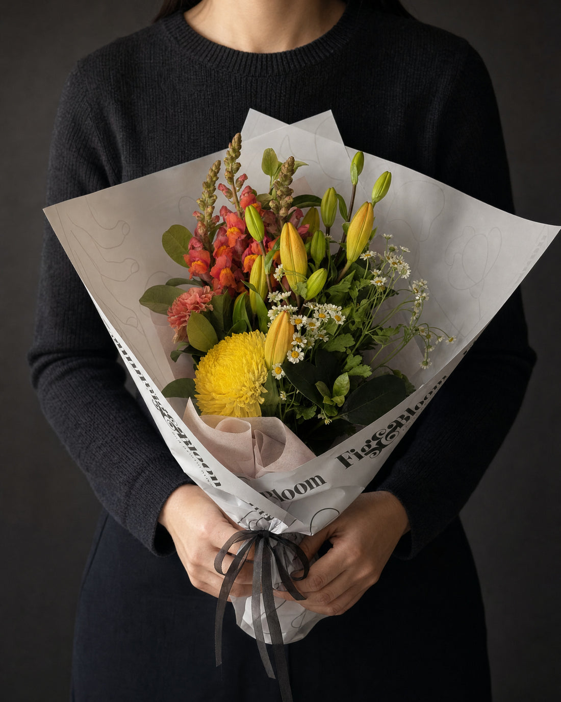 Amalfi Posy by Fig & Bloom held in front at chest height