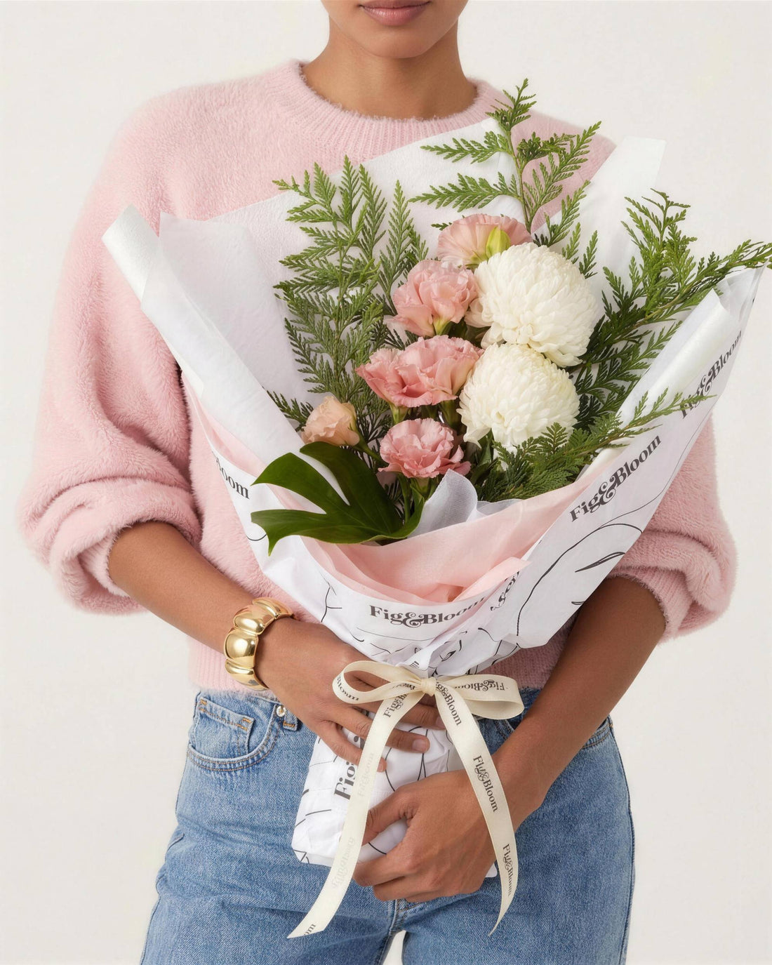 Monaco Bouquet in pink by Fig & Bloom, held in front cradle