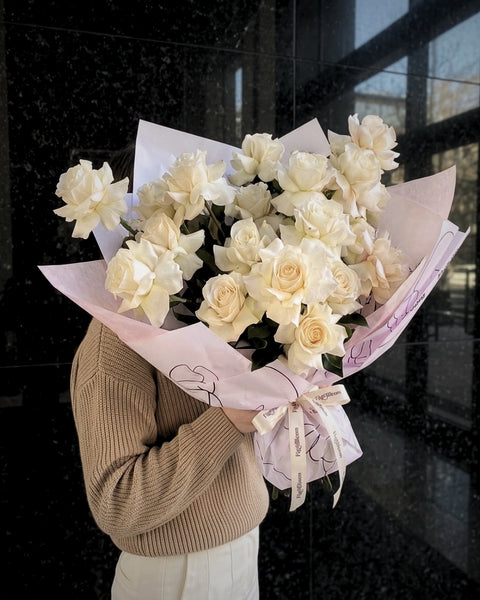 Reflexed white roses arranged by hand by Fig & Bloom