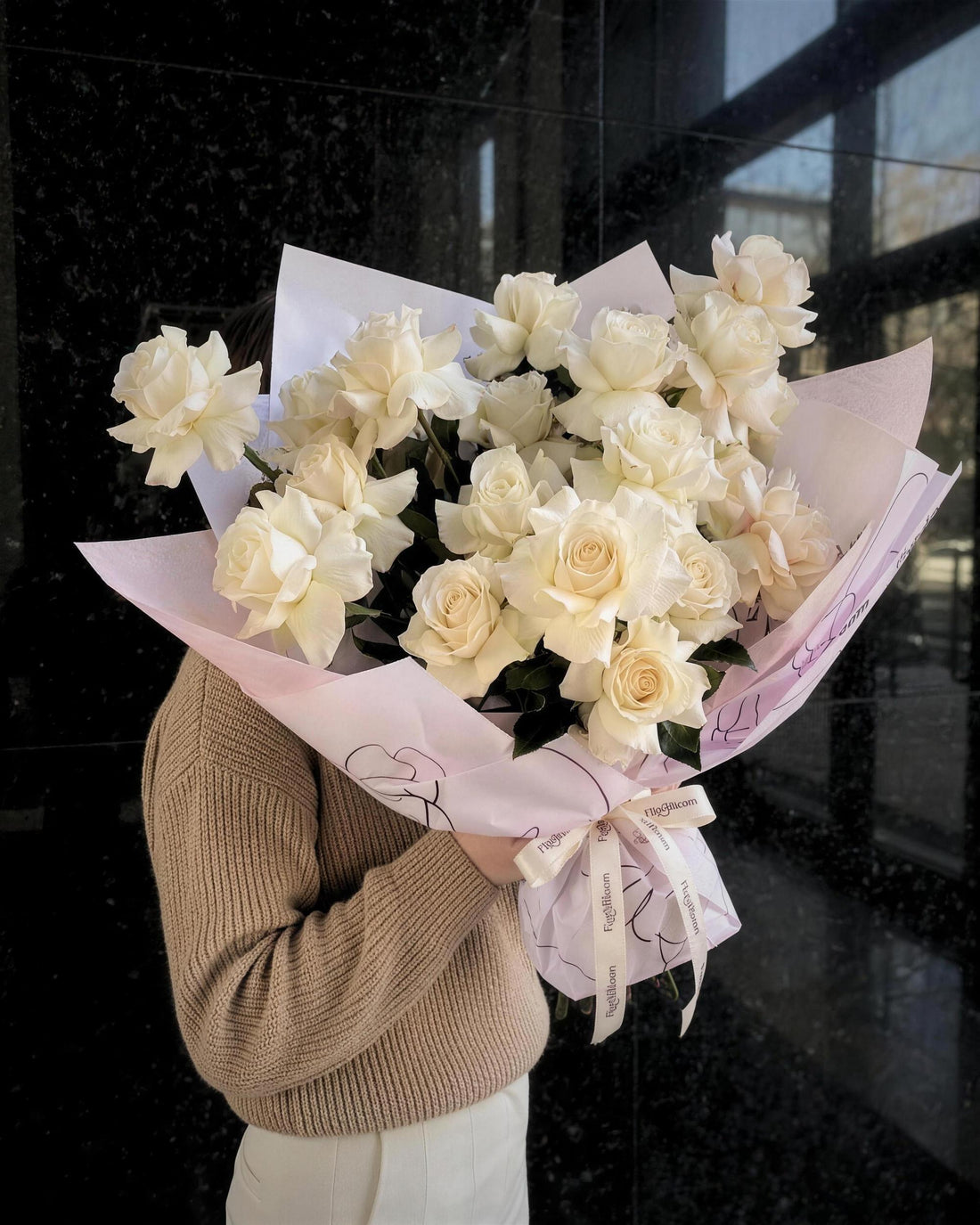 Reflexed white roses arranged by hand by Fig & Bloom