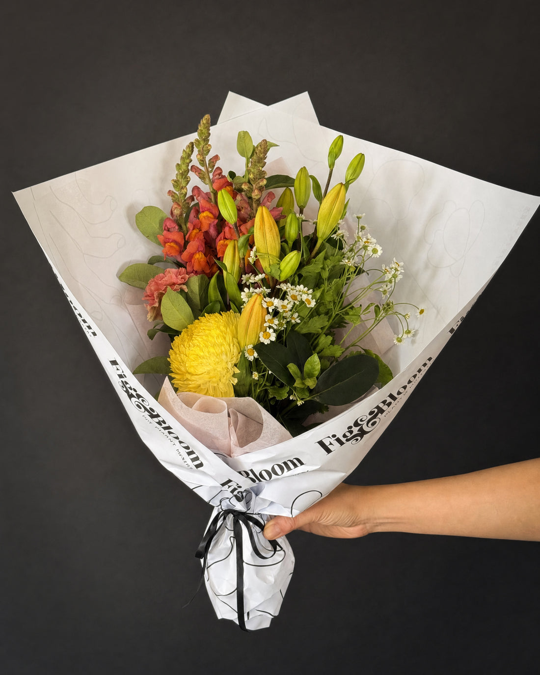 Amalfi Posy by Fig & Bloom held in one hand