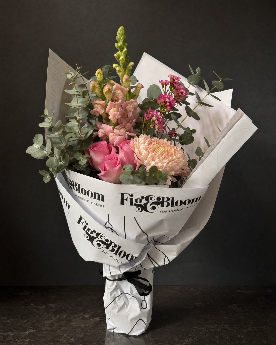 Positano Posy by Fig & Bloom: pink roses, snapdragon and waxflower, hand-tied in printed paper
