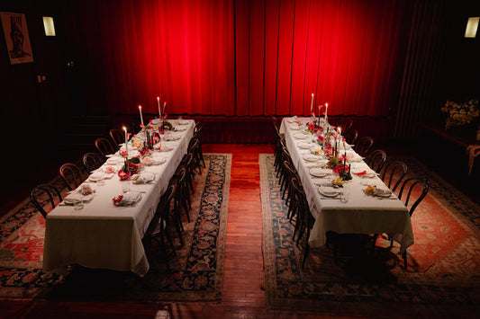 The Theatre Royale at Restaurant Hubert set for the High Floral Design launch lunch, two long tables under the red curtain