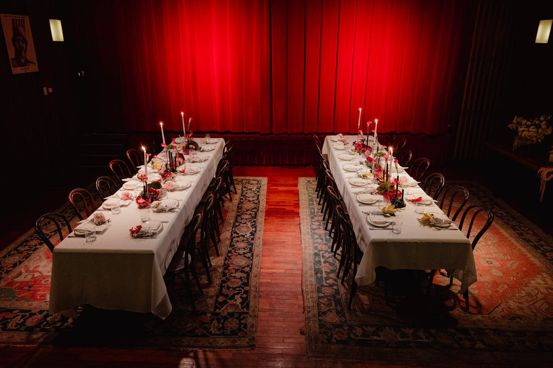The Theatre Royale at Restaurant Hubert set for the High Floral Design launch lunch, two long tables under the red curtain