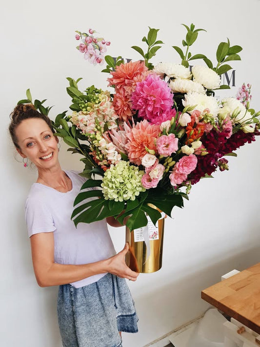 A large seasonal arrangement of dahlias, hydrangeas and protea