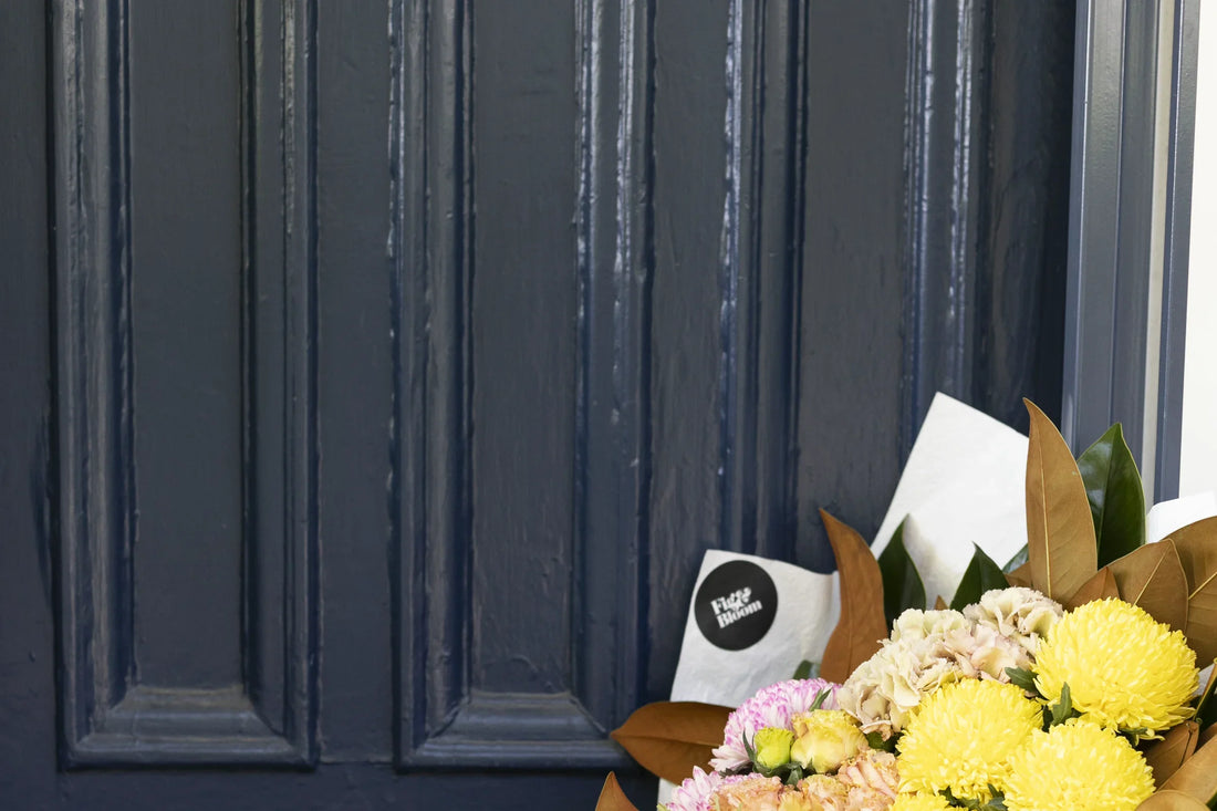 A gift of flowers at a front door