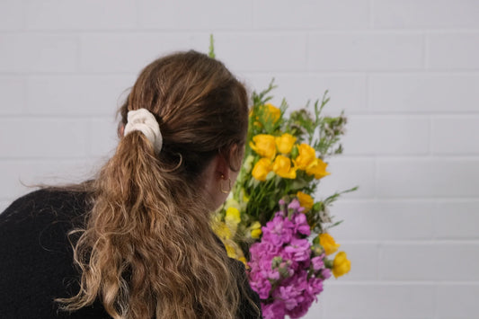 Arranging a colourful bouquet at home