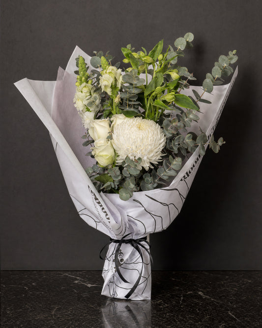 Ravello Posy by Fig & Bloom: white roses, disbud and eucalyptus, hand-tied in printed paper