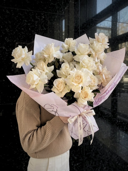 Reflexed white roses arranged by hand by Fig & Bloom
