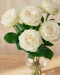 White Roses in Balloon Glass Vase