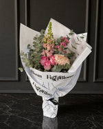 Positano Posy by Fig & Bloom standing on black marble