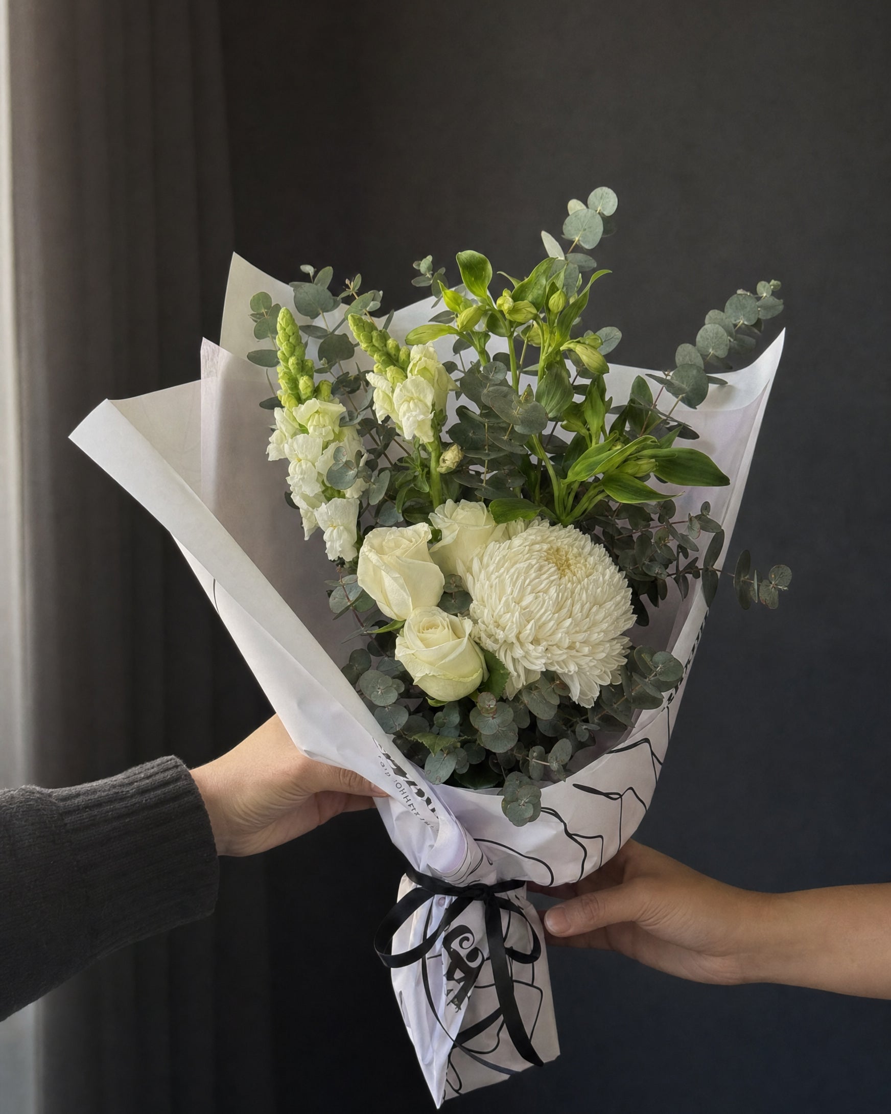 Ravello Posy by Fig & Bloom being handed over