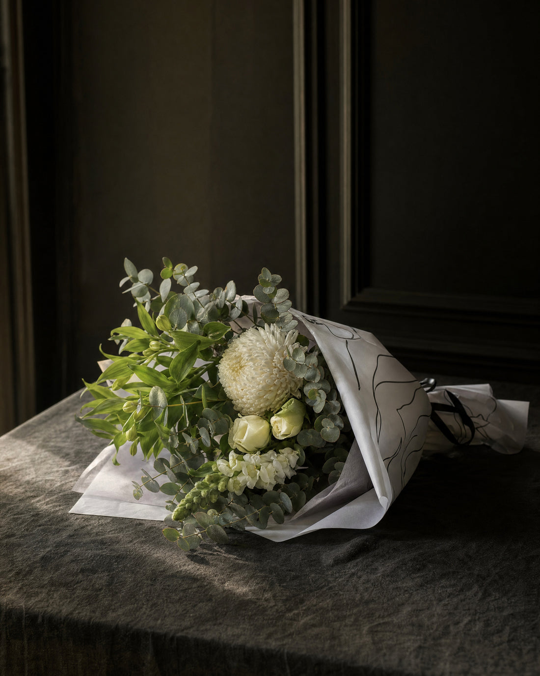 Ravello Posy by Fig & Bloom lying on charcoal linen in window light