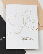 With Love greeting card by Fig & Bloom, gold foil intertwined hearts line illustration with envelope