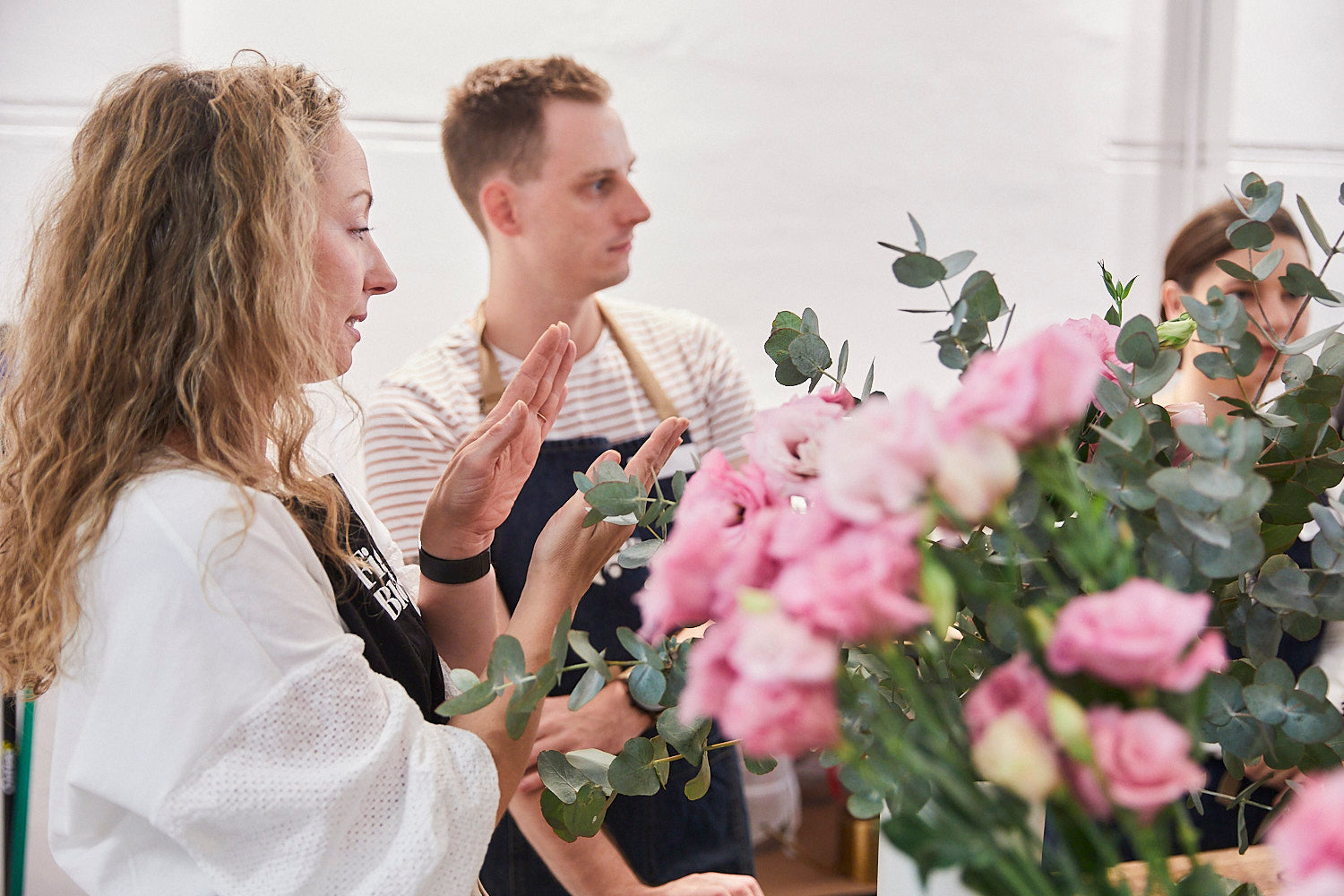 Kellie Brown explaining a technique to a participant at a Fig & Bloom floristry workshop