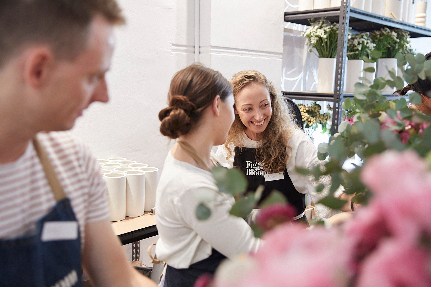 Kellie Brown laughing with participants at a Fig & Bloom floristry workshop