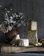 Cheese board with jasmine in a clay vase, from Magnolia Table Volume 3