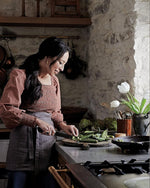 Joanna Gaines cooking in her kitchen, from Magnolia Table Volume 3