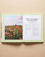 Martha Stewart's Gardening Handbook open at the cutting garden chapter on dahlias