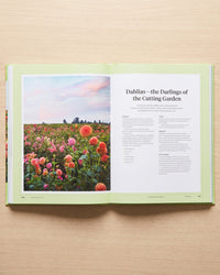 Martha Stewart's Gardening Handbook open at the cutting garden chapter on dahlias