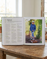Martha Stewart's Gardening Handbook open at the vegetable garden harvest pages