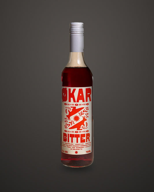 Økar Bitter Aperitivo 700mL by Applewood Distillery, on a charcoal studio sweep