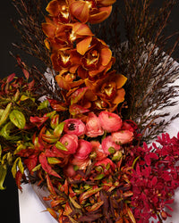 Close detail of the Sienna arrangement in rust, coral and red