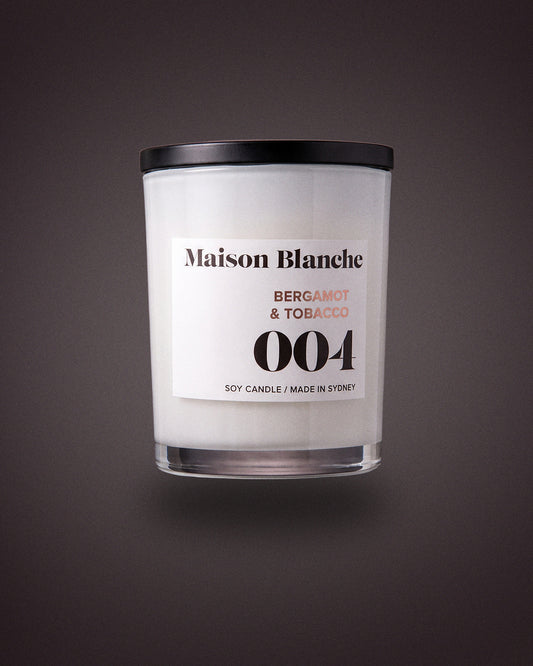 Maison Blanche 004 Bergamot & Tobacco candle, the 15 hour petite candle included in The Nightcap.