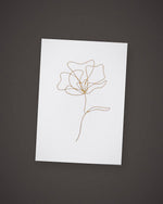 The Single Stem greeting card, gold line art on white, included in The Nightcap.