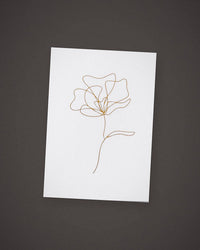 The Single Stem greeting card, gold line art on white, included in The Nightcap.