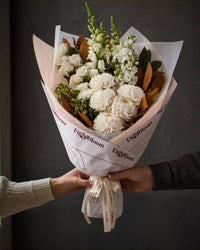 The Toast, the Pyrenees bouquet passed from one pair of hands to another.